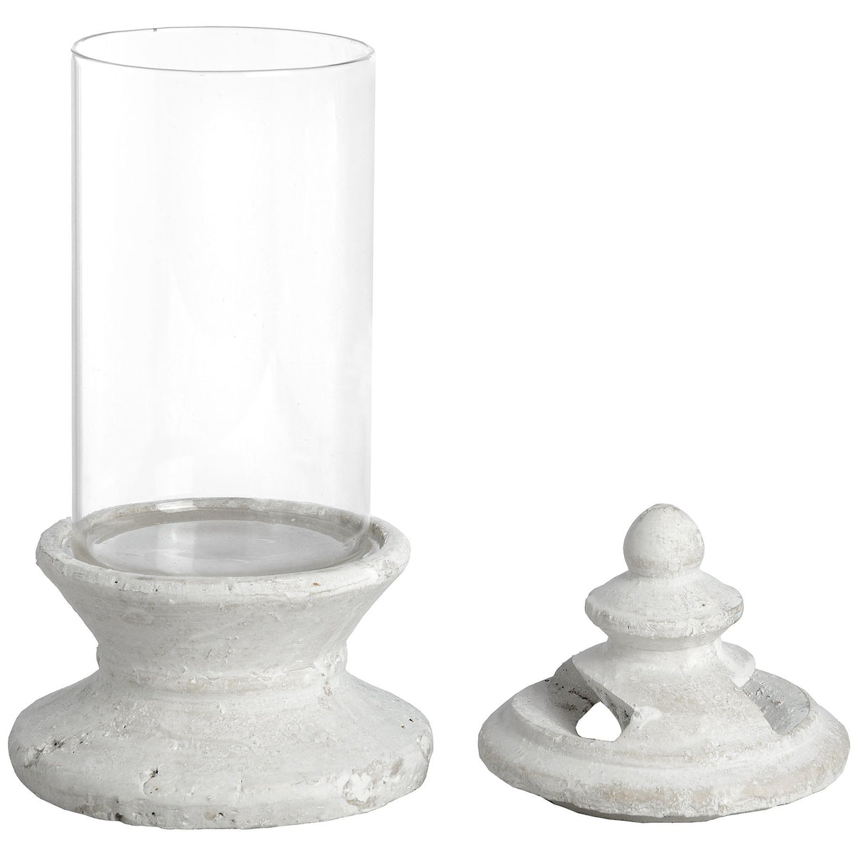 Clear glass hurricane candle holder with a pale distressed pedestal base and matching lid shown alongside