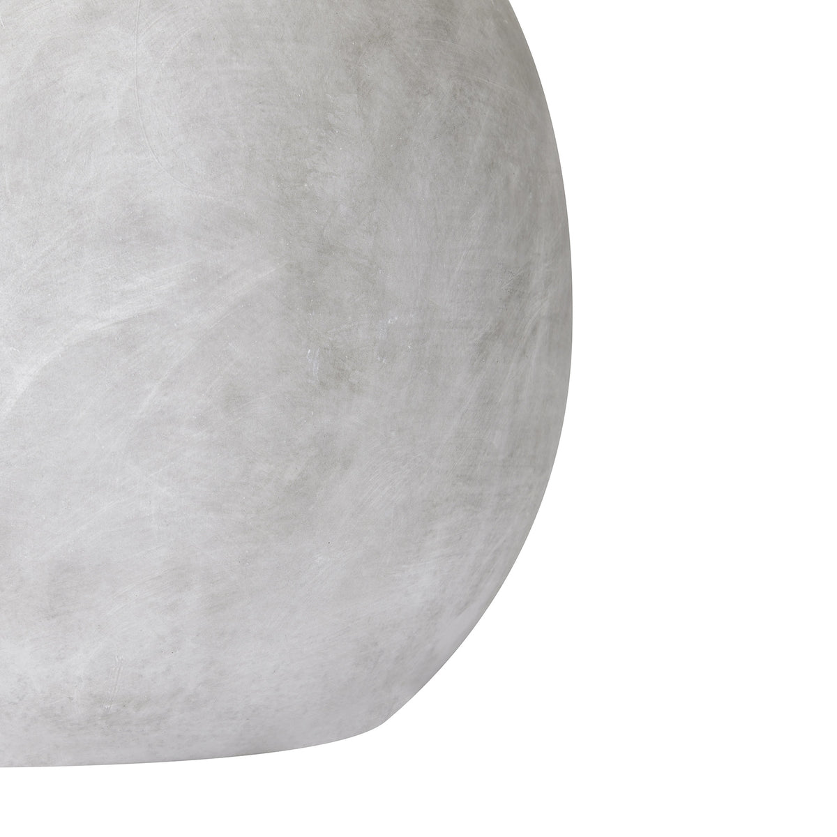 Close-up of the curved matt white ceramic surface of the Darcy Small Globe Vase