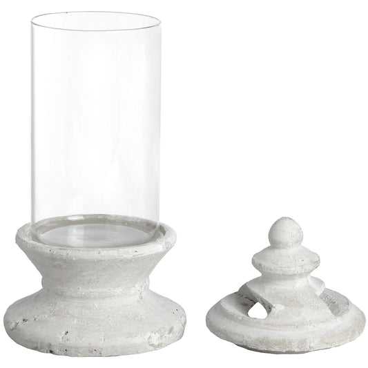 Clear glass hurricane candle holder with a pale distressed pedestal base and matching lid shown alongside