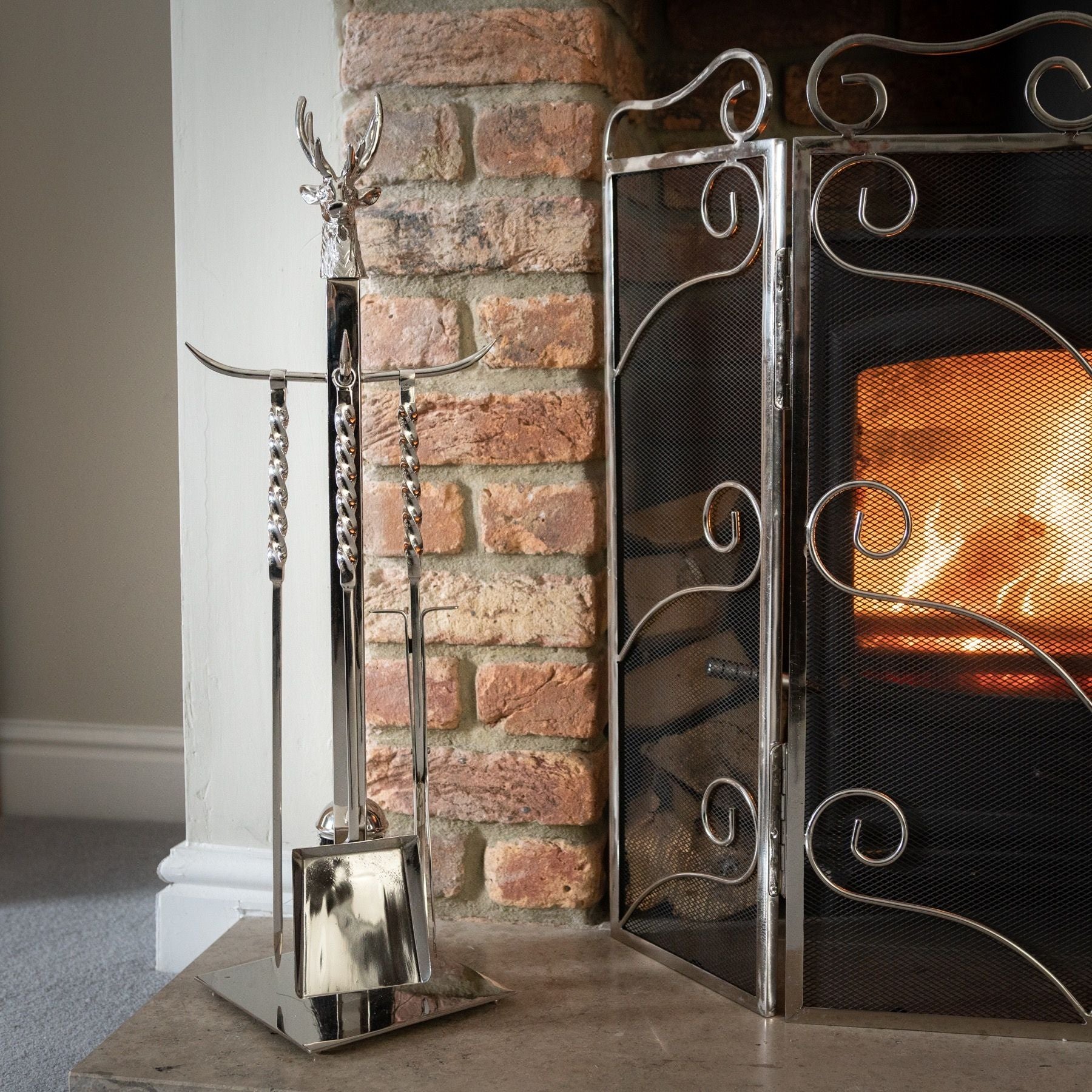 The Hand Turned Stag Companion Set In Polished Nickel is a captivating blend of functionality and exquisite design for your fireside - Fireplace tools
