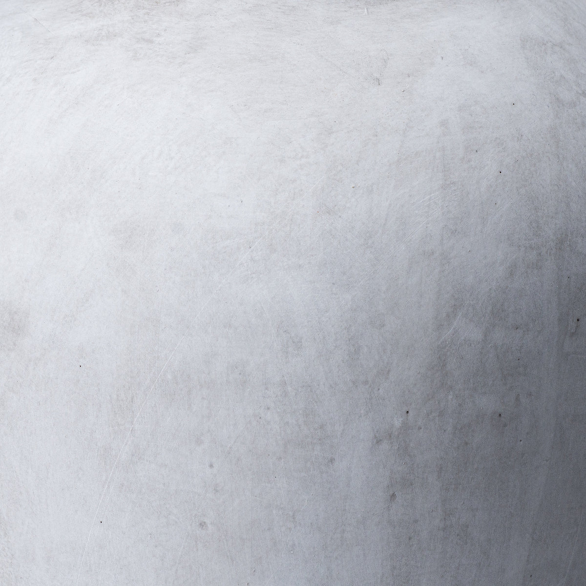 Close-up of the softly mottled stone-effect ceramic surface of the Darcy Stone Vase
