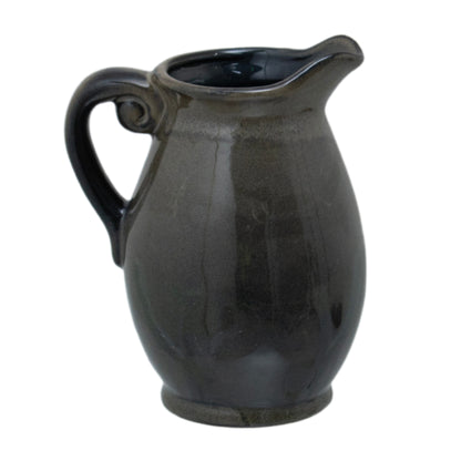 Olive Olpe Vase with a curved ceramic body, scrolling handle, raised lip and dark reactive glaze