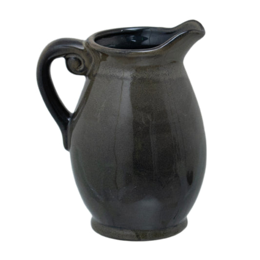 Olive Olpe Vase with a curved ceramic body, scrolling handle, raised lip and dark reactive glaze