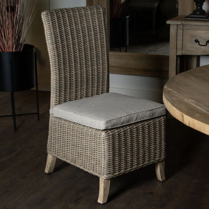 Capri Collection outdoor rattan dining chair with grey cushion and acacia wood legs, weather-resistant wicker garden dining chair
