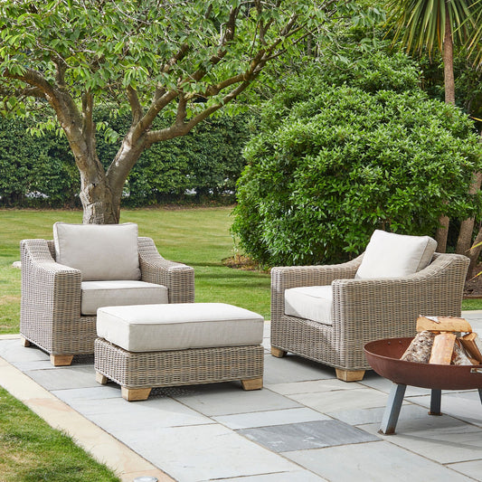 Capri Collection outdoor footstool styled in garden setting, weather-resistant rattan patio ottoman