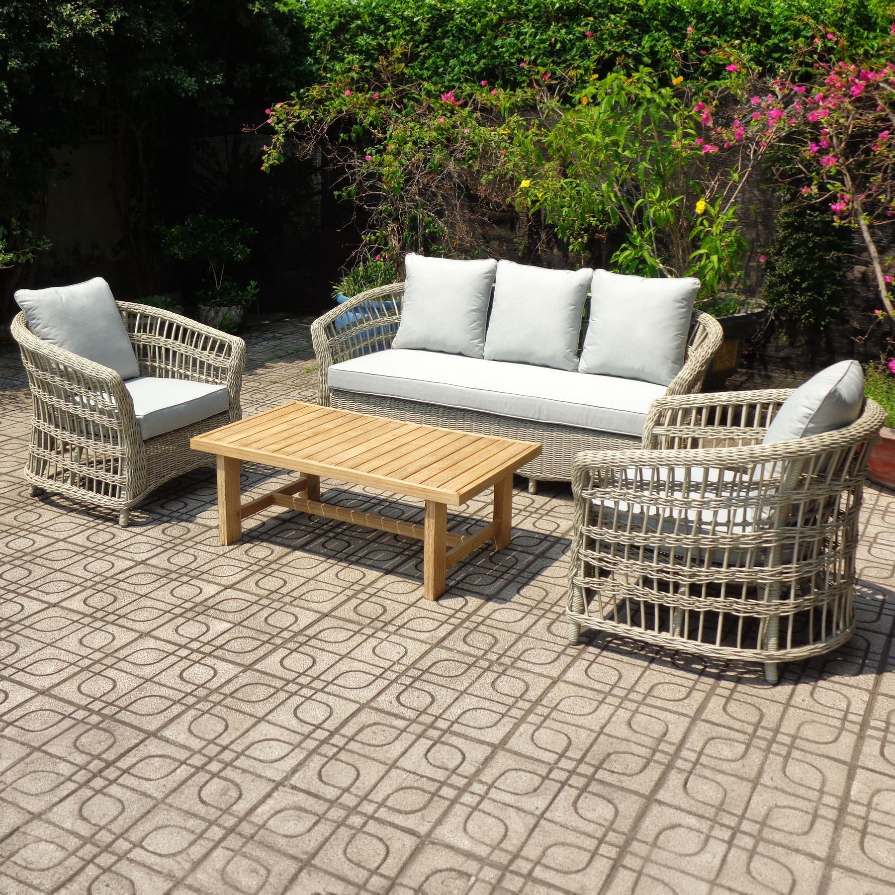 Outdoor patio set with wicker chairs, sofa, and table 