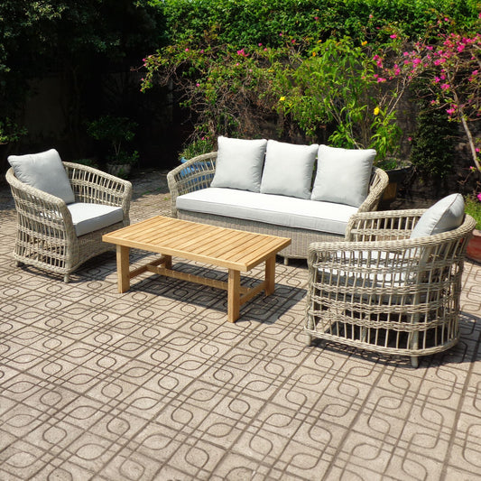 Outdoor patio set with wicker chairs, sofa, and table 