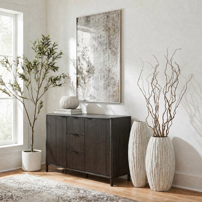 Lorenzo fin vase range styled with branches beside a dark sideboard in a neutral living room