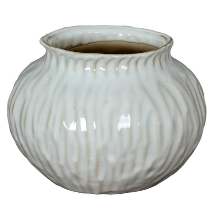 Numa Squat Vase with a low rounded white ceramic body and soft vertical grooves