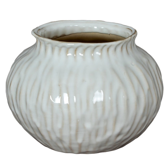 Numa Squat Vase with a low rounded white ceramic body and soft vertical grooves