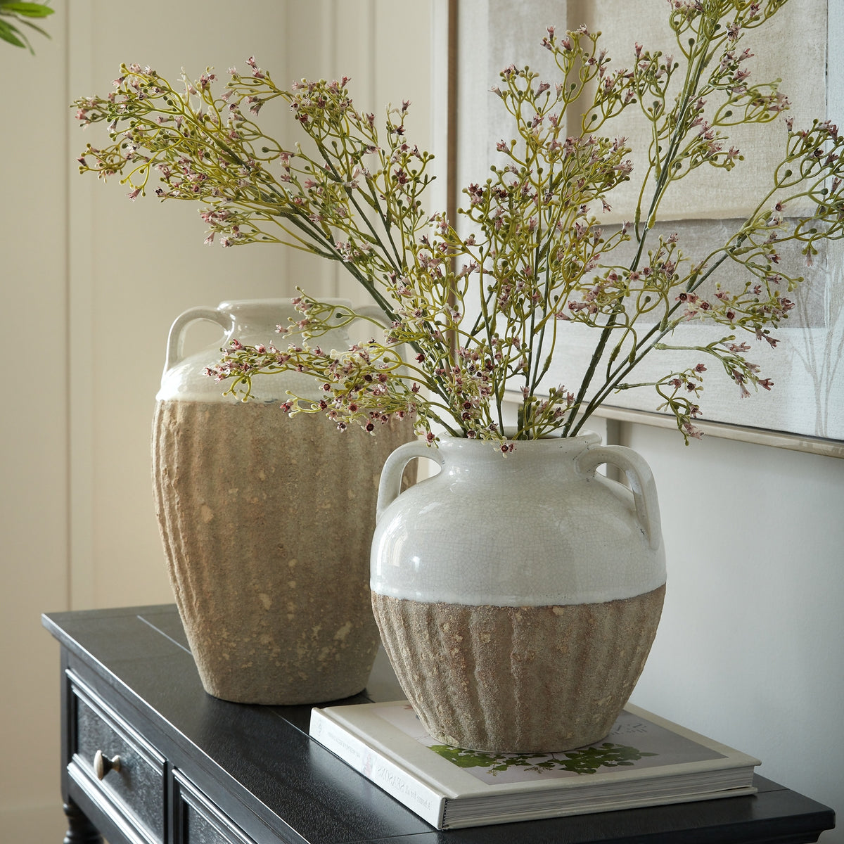 Thorne Medium Amphora Vase holding branching stems on books beside a taller coordinating vase
