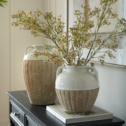 Thorne Medium Amphora Vase holding branching stems on books beside a taller coordinating vase