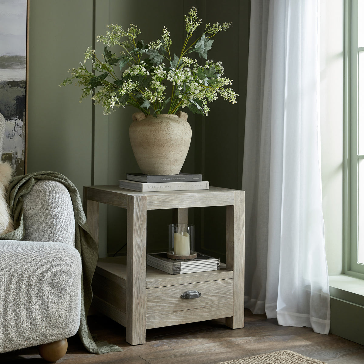 Terra Medium Urn Vase With Handles and foliage styled on a wooden side table