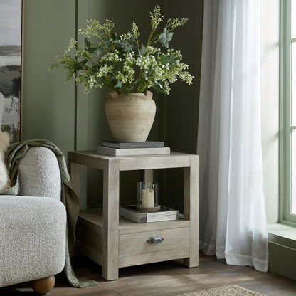 Terra Medium Urn Vase With Handles and foliage styled on a wooden side table