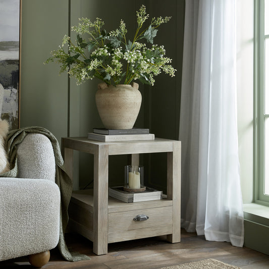 Terra Medium Urn Vase With Handles and foliage styled on a wooden side table
