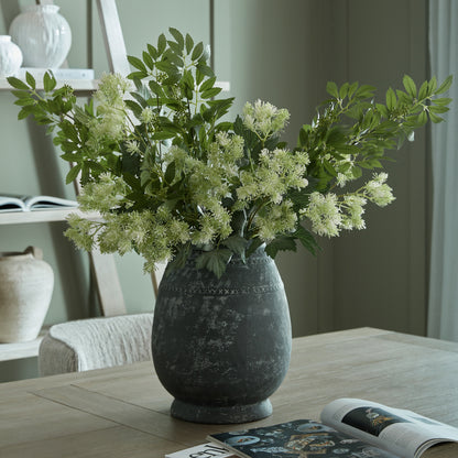 Etched Collection Tall Vase with foliage styled on a wooden dining table