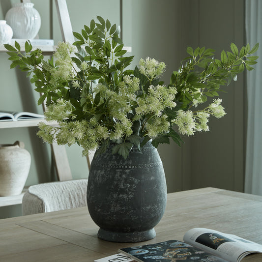 Etched Collection Tall Vase with foliage styled on a wooden dining table